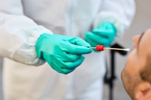 Close-up,Of,Healthcare,Worker,Using,Cotton,Swab,While,Doing,Pcr